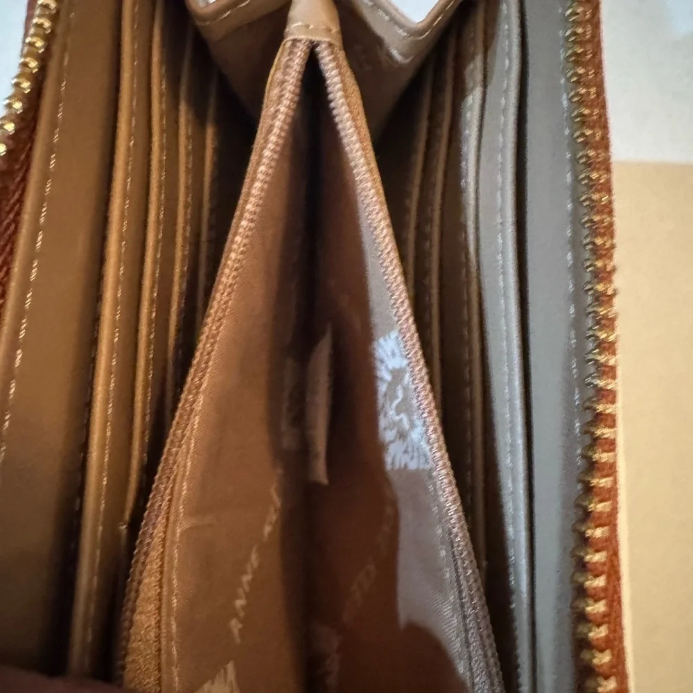 Anne Klein AK Logo Slim Zip Around Wallet in a two-tone Cream and Brown/Saddle